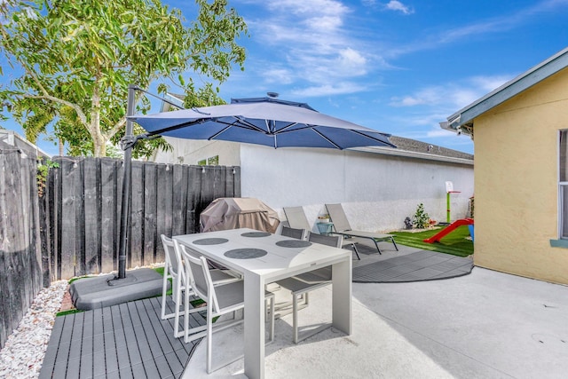 1275 Waterway Cove Dr, Wellington, FL 33414 - view of patio / terrace with outdoor dining space, a grill, and fence