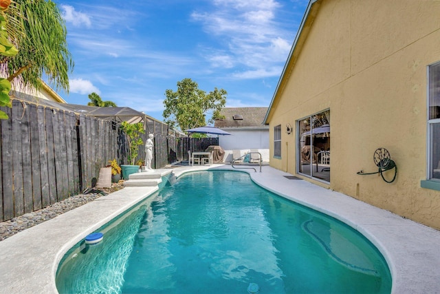1275 Waterway Cove Dr, Wellington, FL 33414 - view of swimming pool featuring a patio area, a fenced backyard, and a fenced in pool