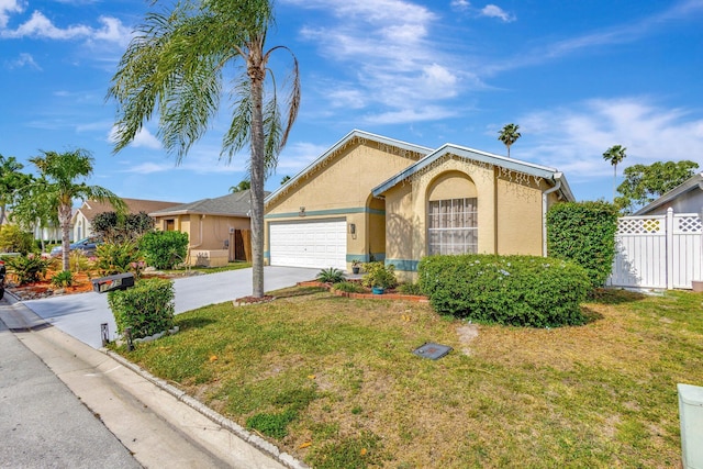 1275 Waterway Cove Dr, Wellington, FL 33414 - ranch-style house featuring an attached garage, driveway, a front yard, and fence