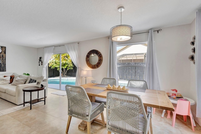1275 Waterway Cove Dr, Wellington, FL 33414 - dining space featuring a textured ceiling and light tile patterned floors