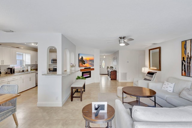 1275 Waterway Cove Dr, Wellington, FL 33414 - living room with visible vents, baseboards, and ceiling fan