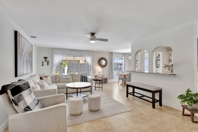 1275 Waterway Cove Dr, Wellington, FL 33414 - living area with a ceiling fan, visible vents, light tile patterned floors, and a healthy amount of sunlight