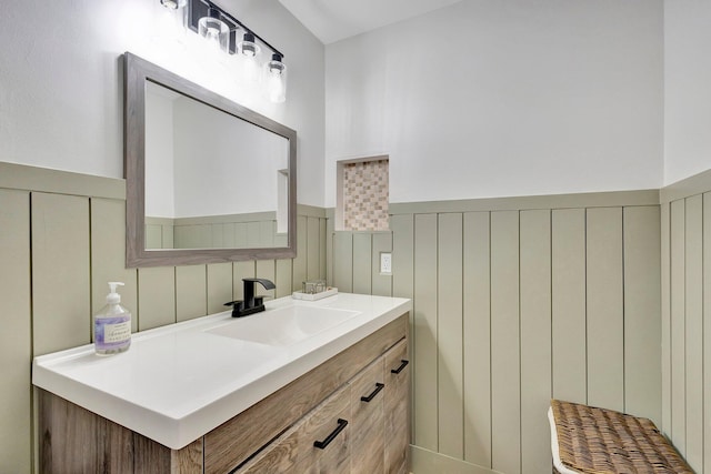 1275 Waterway Cove Dr, Wellington, FL 33414 - bathroom with vanity, a decorative wall, and a wainscoted wall