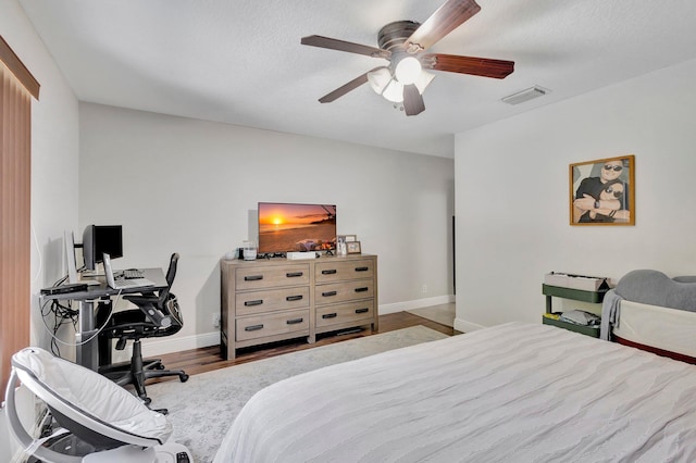 1275 Waterway Cove Dr, Wellington, FL 33414 - bedroom featuring wood finished floors, visible vents, a ceiling fan, and baseboards