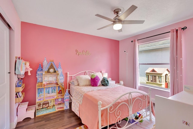 1275 Waterway Cove Dr, Wellington, FL 33414 - bedroom with ceiling fan, wood finished floors, and a closet