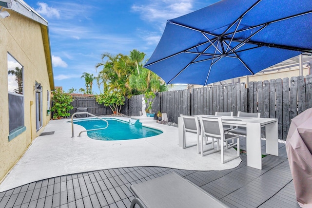1275 Waterway Cove Dr, Wellington, FL 33414 - view of swimming pool featuring a fenced backyard, a fenced in pool, outdoor dining area, and a patio