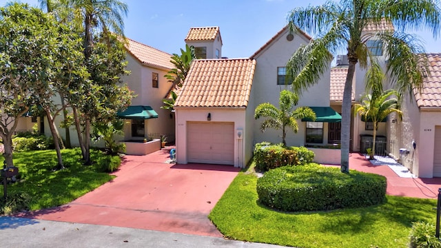 6130 Via Tierra, Boca Raton, FL 33433 - mediterranean / spanish house featuring central AC, stucco siding, a tiled roof, an attached garage, and driveway