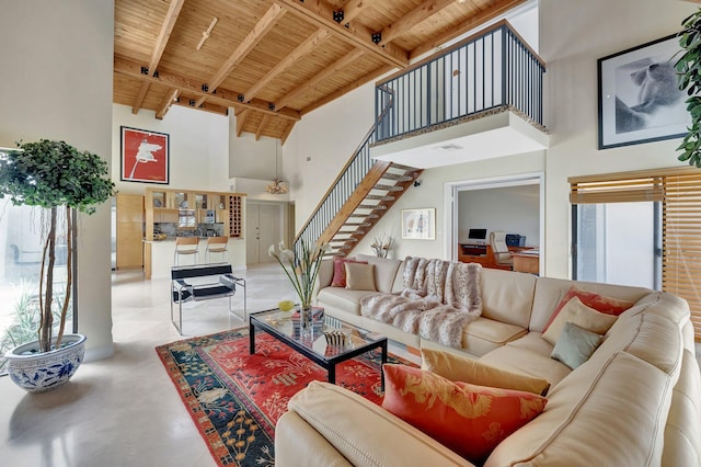 6130 Via Tierra, Boca Raton, FL 33433 - living area featuring beam ceiling, wood ceiling, a high ceiling, and stairway