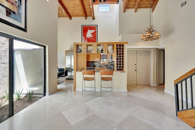 6130 Via Tierra, Boca Raton, FL 33433 - interior space with wood ceiling, a towering ceiling, and a notable chandelier