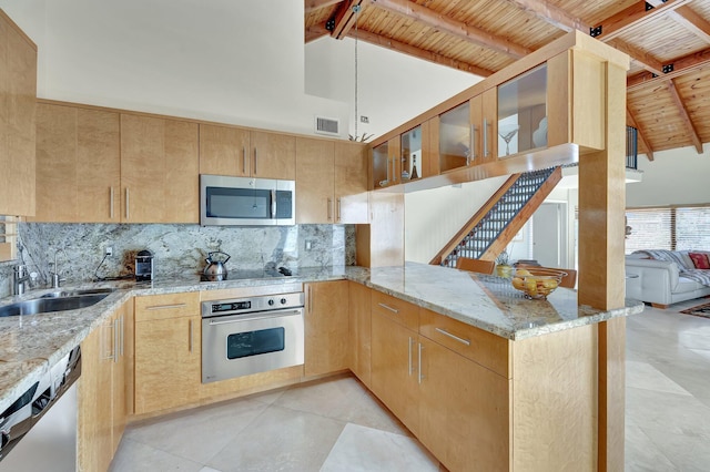 6130 Via Tierra, Boca Raton, FL 33433 - kitchen with light stone counters, a sink, tasteful backsplash, and stainless steel appliances