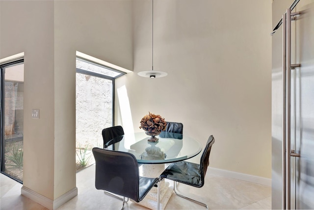 6130 Via Tierra, Boca Raton, FL 33433 - dining space with a healthy amount of sunlight, baseboards, and a high ceiling