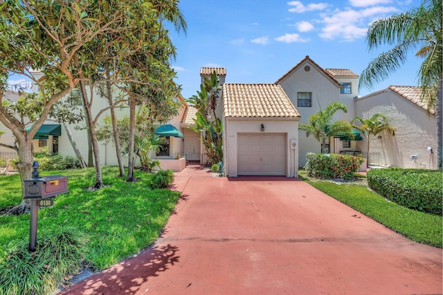 6130 Via Tierra, Boca Raton, FL 33433 - mediterranean / spanish house featuring fence, a garage, stucco siding, a tiled roof, and driveway