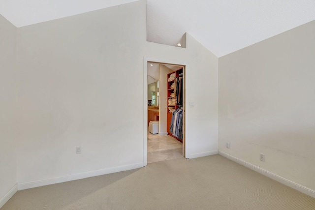 6130 Via Tierra, Boca Raton, FL 33433 - empty room with baseboards, vaulted ceiling, and light colored carpet