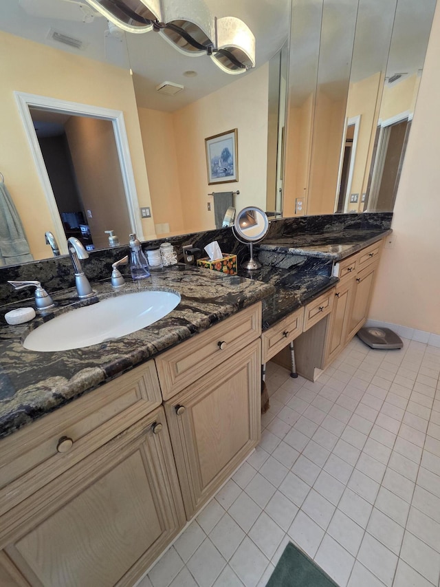 bathroom featuring vanity, tile patterned flooring, and visible vents