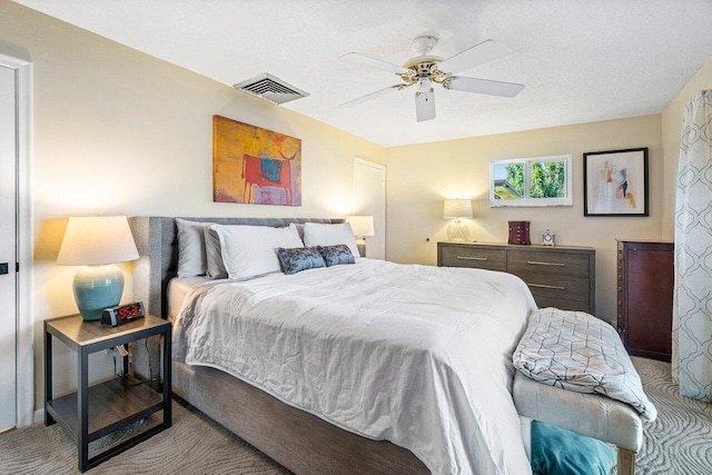bedroom featuring visible vents, carpet flooring, and a ceiling fan