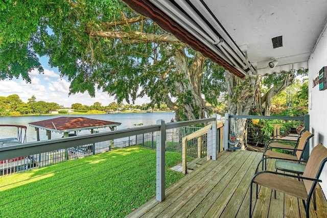 deck featuring a water view and a yard