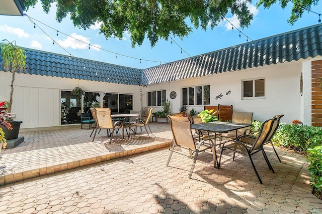 view of patio featuring outdoor dining area