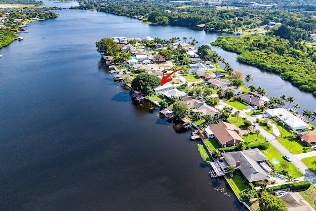 birds eye view of property with a residential view and a water view