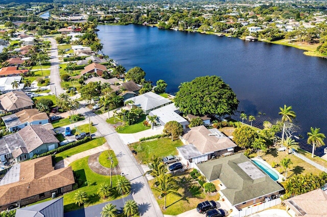 drone / aerial view featuring a water view and a residential view