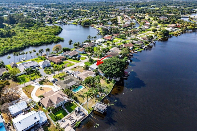 aerial view with a residential view and a water view