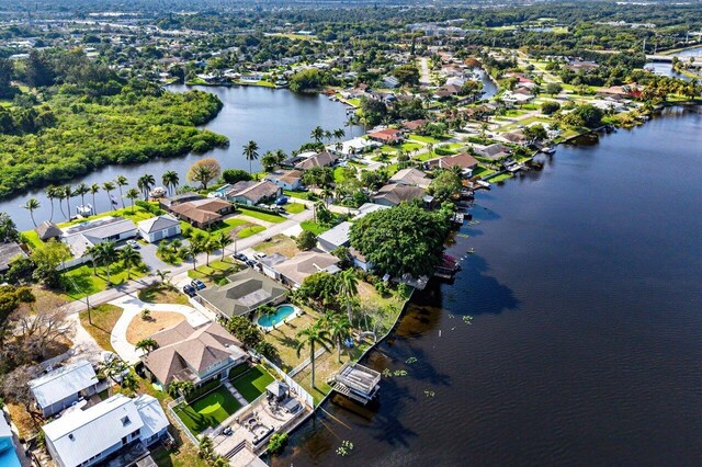 bird's eye view with a residential view and a water view
