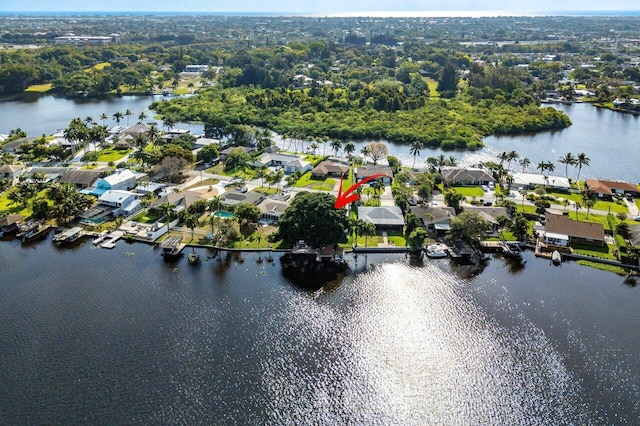drone / aerial view featuring a residential view and a water view