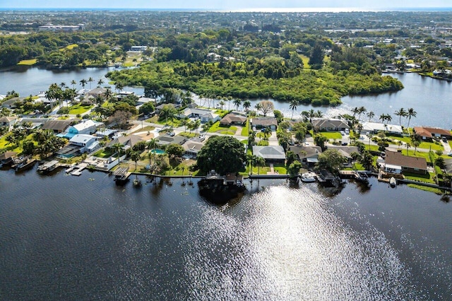 bird's eye view with a residential view and a water view