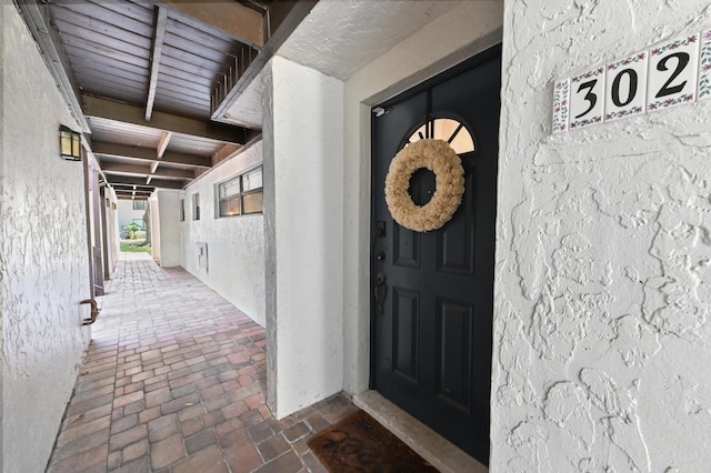 149 NW 70th St Unit 302B, Boca Raton, FL 33487 - doorway to property with stucco siding