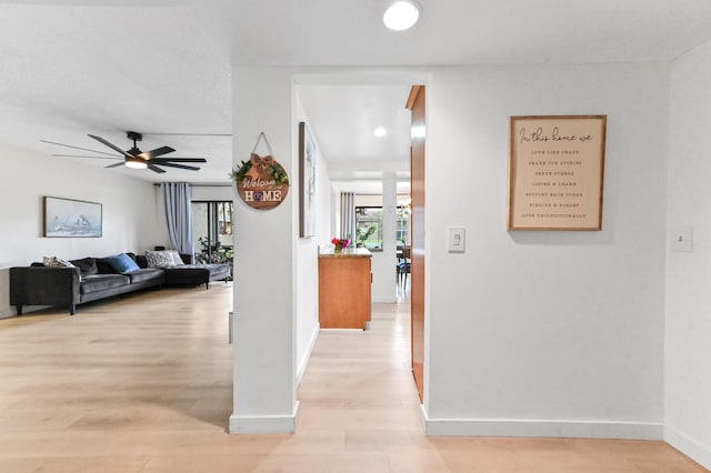 149 NW 70th St Unit 302B, Boca Raton, FL 33487 - corridor featuring light wood finished floors and baseboards