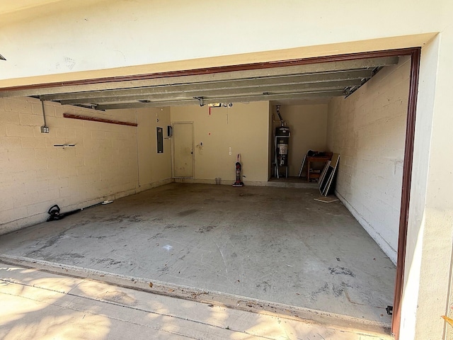 garage with water heater and electric panel
