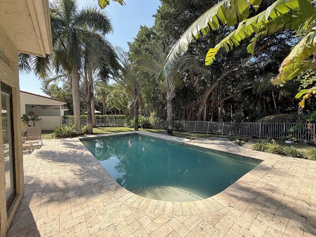 view of pool with a patio and a fenced backyard