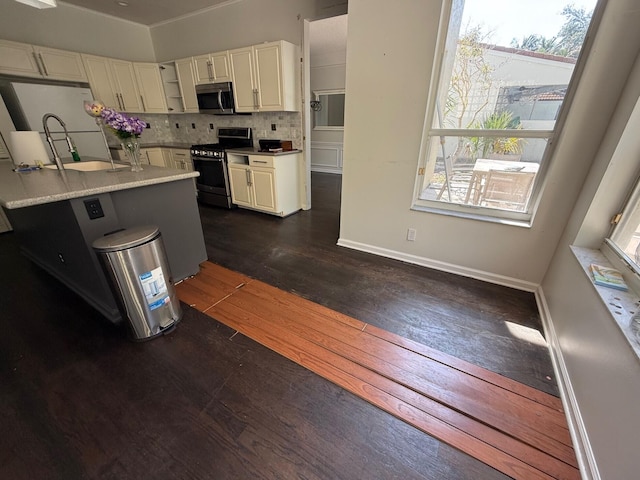 kitchen featuring stainless steel appliances, plenty of natural light, decorative backsplash, and dark wood-style floors