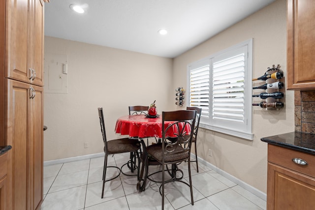 dining room featuring recessed lighting, baseboards, and light tile patterned floors