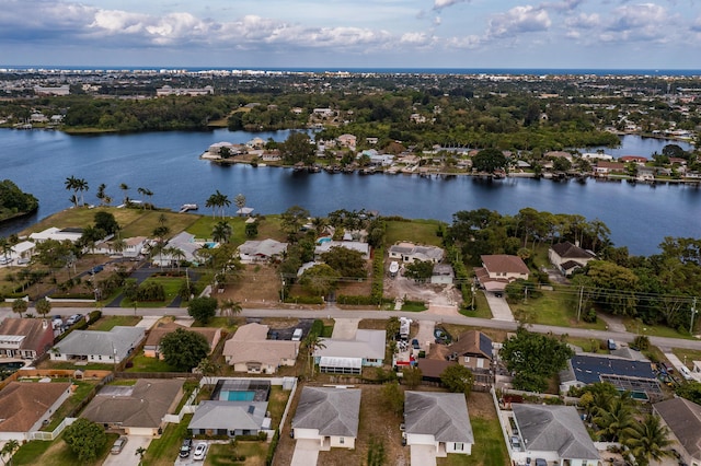 birds eye view of property with a residential view and a water view