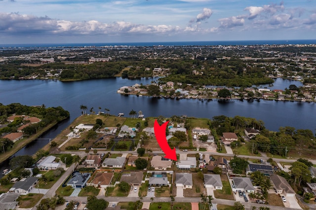 aerial view featuring a residential view and a water view