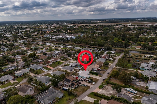 birds eye view of property with a residential view