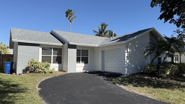 11771 NW 37th St, Sunrise, FL 33323 - ranch-style home featuring brick siding, an attached garage, a front yard, and aphalt driveway