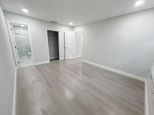 11771 NW 37th St, Sunrise, FL 33323 - unfurnished bedroom with wood finished floors, baseboards, and recessed lighting