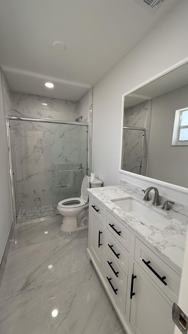 11771 NW 37th St, Sunrise, FL 33323 - full bath featuring marble finish floor, toilet, vanity, and a marble finish shower