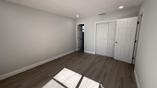 11771 NW 37th St, Sunrise, FL 33323 - unfurnished bedroom featuring a closet, baseboards, dark wood-style flooring, visible vents, and recessed lighting