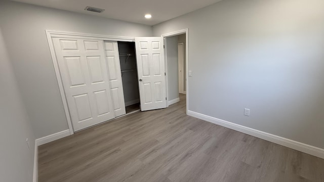 11771 NW 37th St, Sunrise, FL 33323 - unfurnished bedroom featuring recessed lighting, wood finished floors, visible vents, a closet, and baseboards