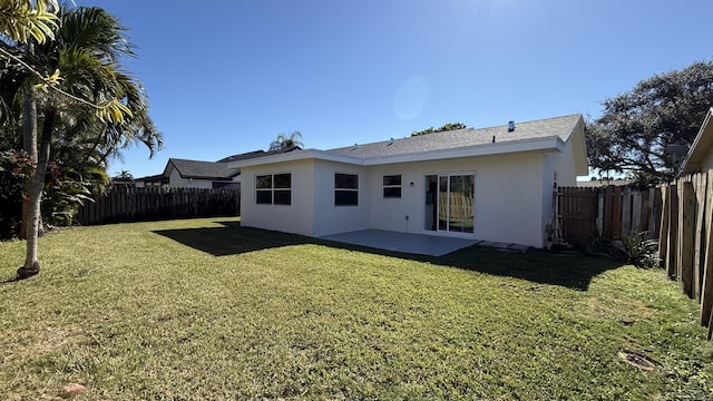 11771 NW 37th St, Sunrise, FL 33323 - rear view of house with stucco siding, a yard, a patio area, and a fenced backyard