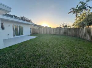 11771 NW 37th St, Sunrise, FL 33323 - yard at dusk featuring a fenced backyard