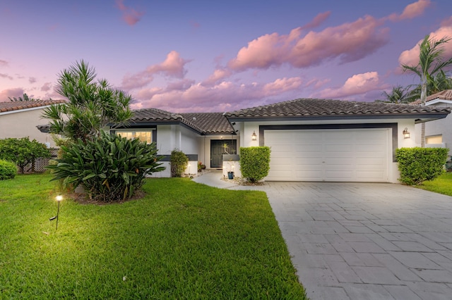 7414 Rosewood Cir, Boca Raton, FL 33487 - view of front facade with stucco siding, a tile roof, decorative driveway, and an attached garage