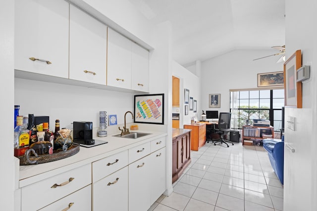 7414 Rosewood Cir, Boca Raton, FL 33487 - kitchen with high vaulted ceiling, a sink, light countertops, and light tile patterned floors