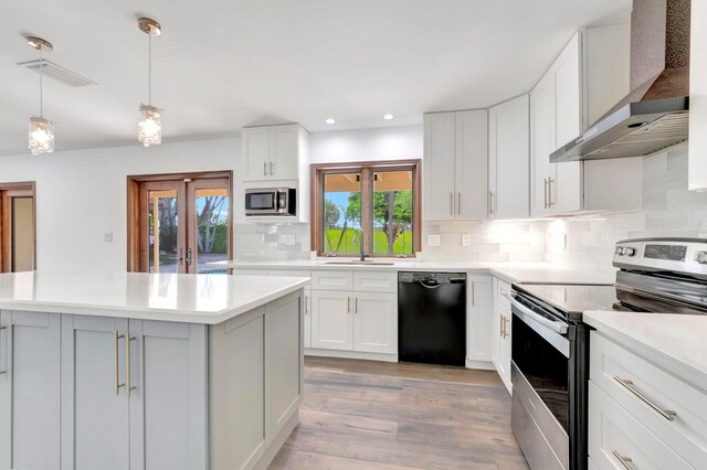 4770 Fox Hunt Trl, Boca Raton, FL 33487 - kitchen with black dishwasher, a sink, stainless steel microwave, light countertops, and recessed lighting