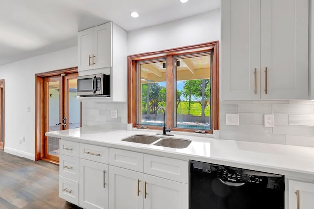 4770 Fox Hunt Trl, Boca Raton, FL 33487 - kitchen featuring dishwasher, a sink, stainless steel microwave, light countertops, and recessed lighting