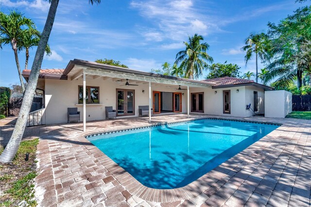 4770 Fox Hunt Trl, Boca Raton, FL 33487 - view of front of home featuring a tile roof, a garage, driveway, and stucco siding