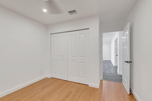 4770 Fox Hunt Trl, Boca Raton, FL 33487 - unfurnished bedroom with light wood-style floors, baseboards, recessed lighting, and a closet