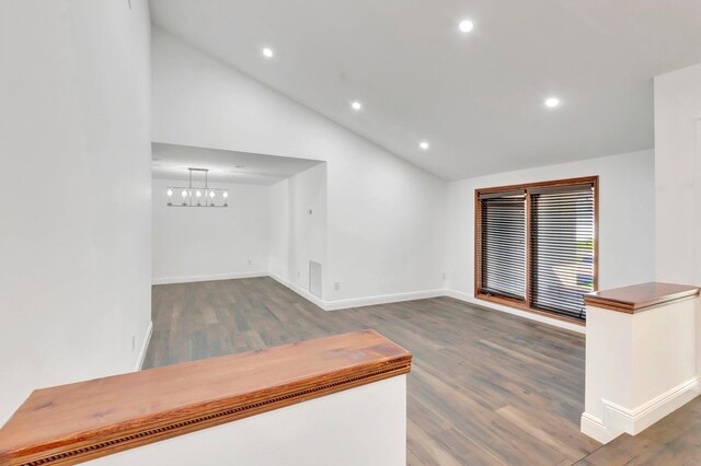 4770 Fox Hunt Trl, Boca Raton, FL 33487 - hallway featuring a chandelier, high vaulted ceiling, recessed lighting, dark wood finished floors, and baseboards
